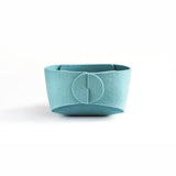 Front view of small duck egg blue felt bowl