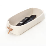 White felt TV remote control holder. Sturdy remote caddy in wool felt with leather toggles